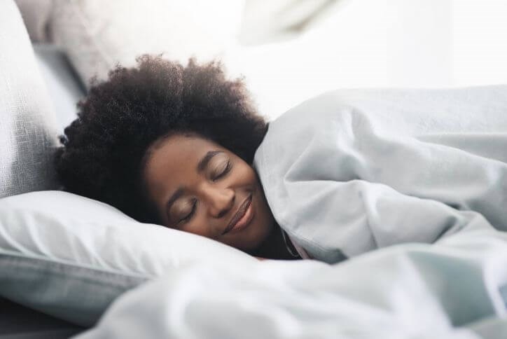 Lady sleeping in a bed