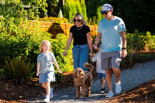 A family walks one of Tehaleh's many trails.